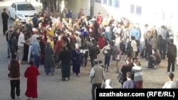 Residents of the eastern city of Turkmenabat, pictured in October 2018, waiting to buy flour in front of a state store. 