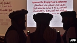 Members of the Taliban delegation gather in Qatar for peace talks that began in September.