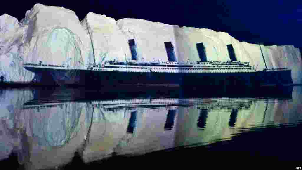 An image of the "Titanic" is projected on a 500-meter-long iceberg off the coast of Greenland on April 13, 2012, in a tribute to the disaster by Swiss light artist Gerry Hofstetter.