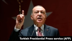 Critics have accused Turkish President Recep Tayyip Erdogan of using a failed coup as a pretext to quash dissent. (file photo)