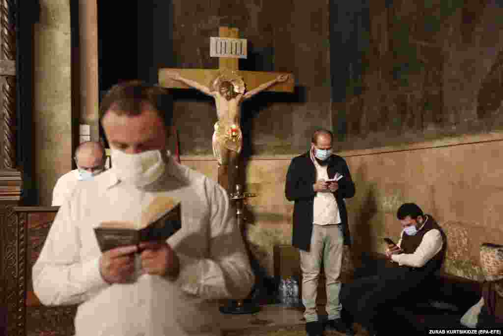 People attend an Easter service at Trinity Cathedral in Tbilisi, Georgia.