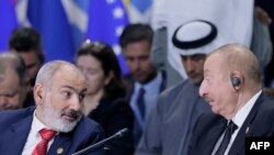 Azerbaijan's President Ilham Aliyev and Armenia's Prime Minister Nikol Pashinyan attend a plenary session in the outreach/BRICS Plus format at the BRICS summit in Kazan on October 24, 2024. (Photo by Maxim Shemetov / POOL / AFP)