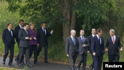 The leaked cables offer unvarnished views on some of the world's most powerful leaders (seen here at a G8 meeting in Ontario, Canada, in June).