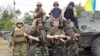 Иса Мунаев (второй справа в нижнем ряду) на Украине. Лето 2014 года