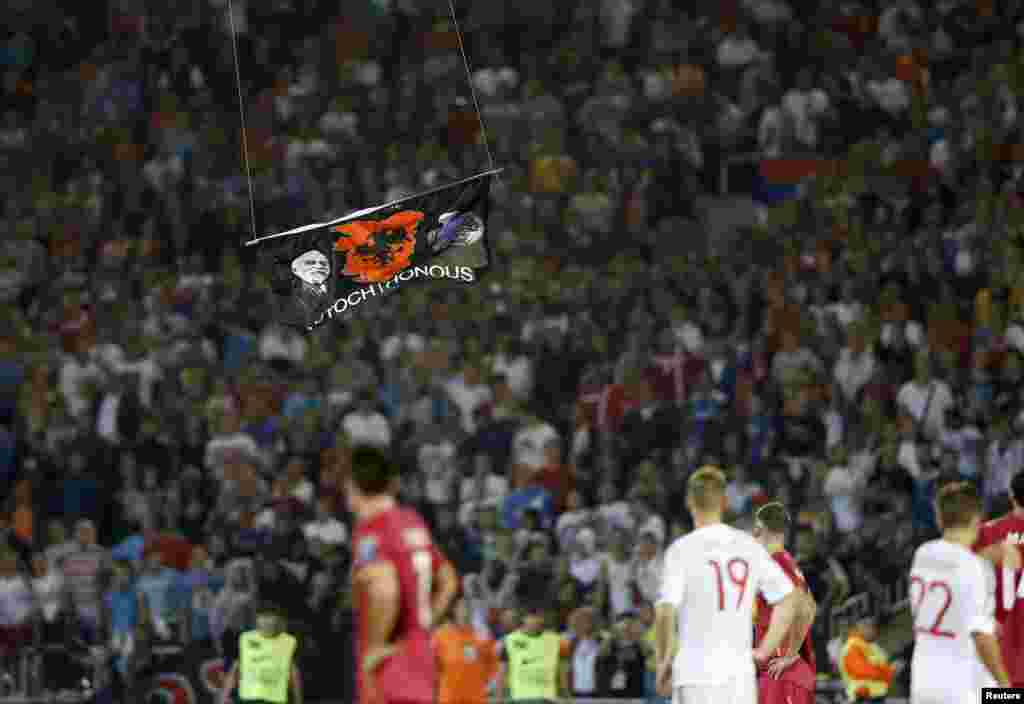 As it approached the field, it became clear that a flag was bearing a "Greater Albania" emblem -- a notion that would extend to Kosovo.