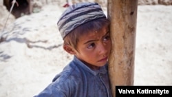 Khalid, 8, fled with his family from their home in Samangan Province.