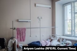 Tatyana rests in her hospital bed.