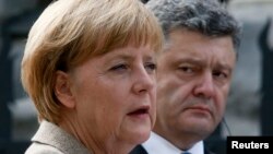 Germany's Chancellor Angela Merkel speaks during a news conference with Ukraine's President Petro Poroshenko in Kyiv.