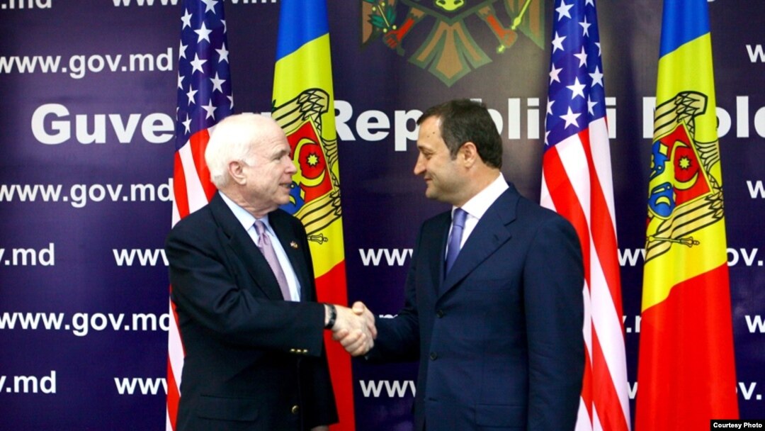 U.S. Senator John McCain (left) and Moldovan Prime Minister Vlad Filat meet in Chisinau.