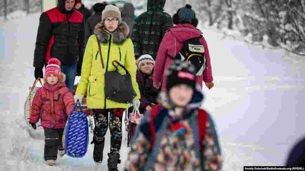 A young family heading toward separatist-held territory. 
