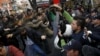 Turkish police use a tear-inducing agent against demonstrators during a protest over the arrest of two reporters in Ankara late last year. Turkish President Recep Tayyip Erdogan was singled out in the Freedom House report for his crackdown on journalists.