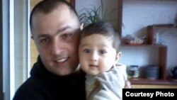 Aramais Avakian with his one-year-old daughter.