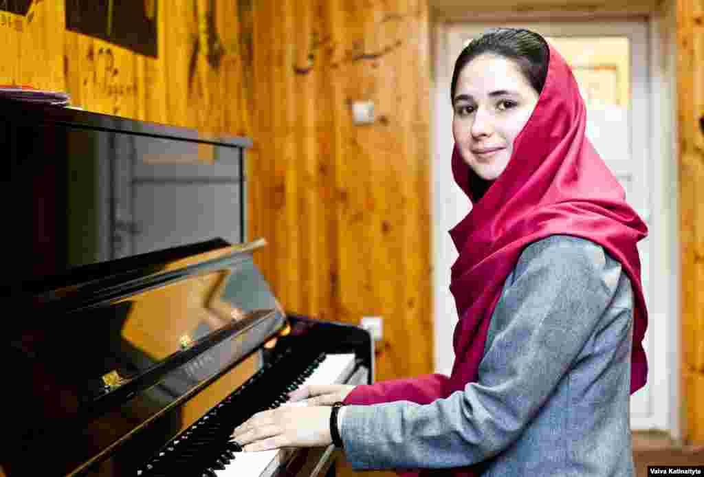 Negin Khalpak, 14, conducts around 35 students in the institute's orchestra.