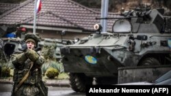 A Russian peacekeeper shouts "No pictures !" at a checkpoint outside Nagorno-Karabakh's main city of Stepanakert on November 13.