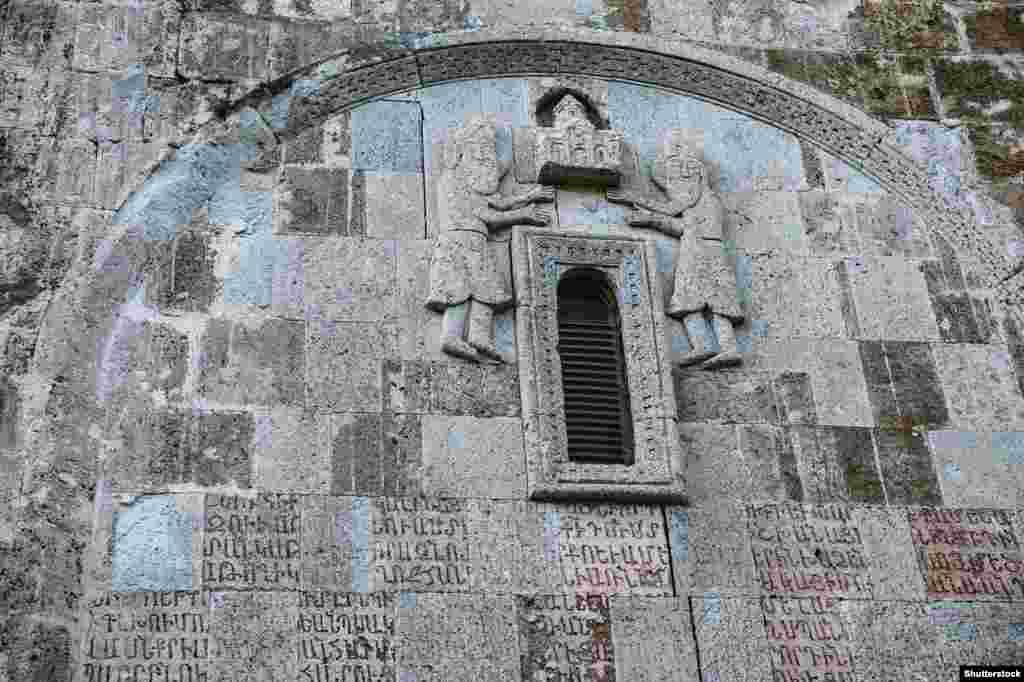 Details of a stone carving and Armenian script inside Dadivank. The monastery was completed in the 13th century. 