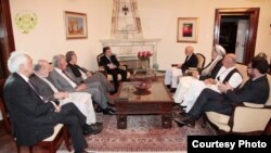 Afghan President Hamid Karzai (center right) holds talks on September 15 to try and resolve Afghanistan's crisis over a disputed presidential election.