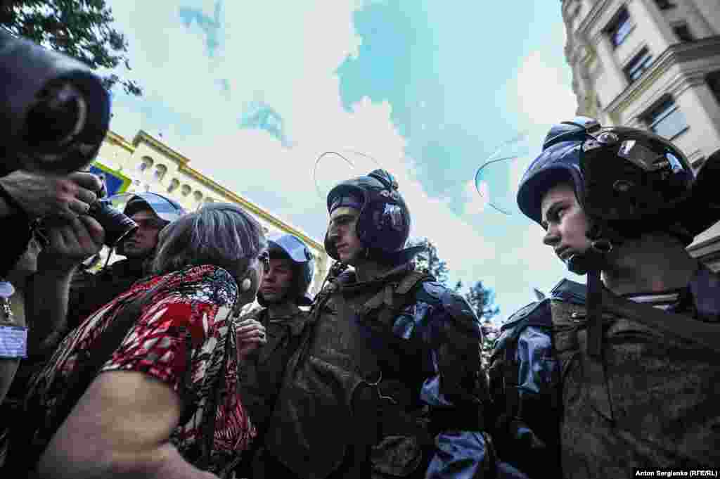 A woman remonstrates with police who seemed intent on ensuring crowds could not gather at the proposed protest site near the Moscow mayor's office. 